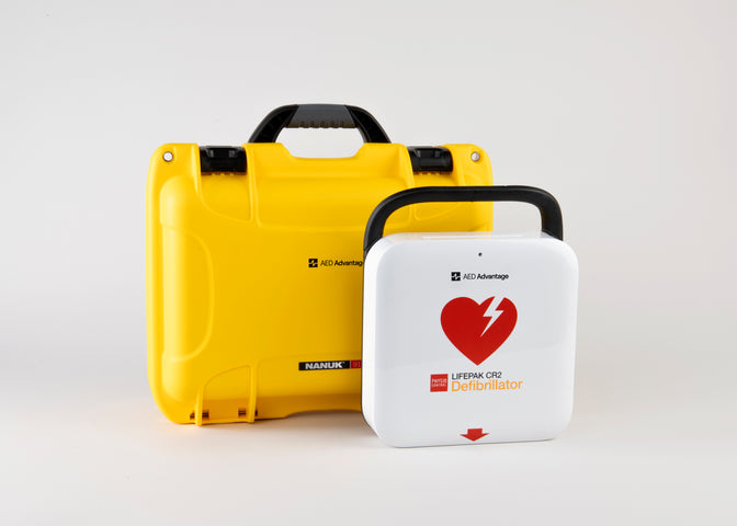 A white and red LIFEPAK CR2 AED machine and a bright yellow hardshell carry case