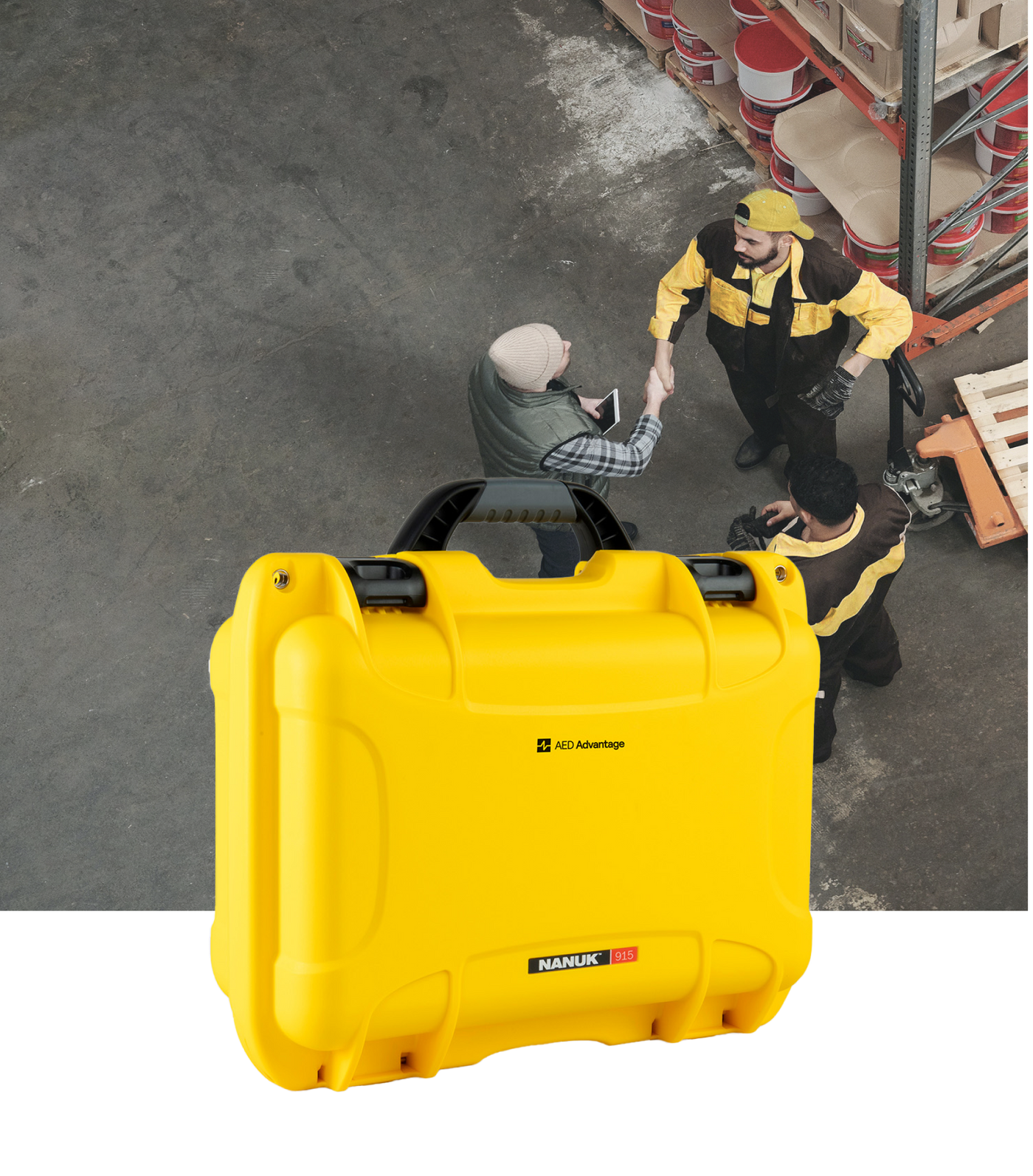 People working in a warehouse with a bright yellow AED carry case in front