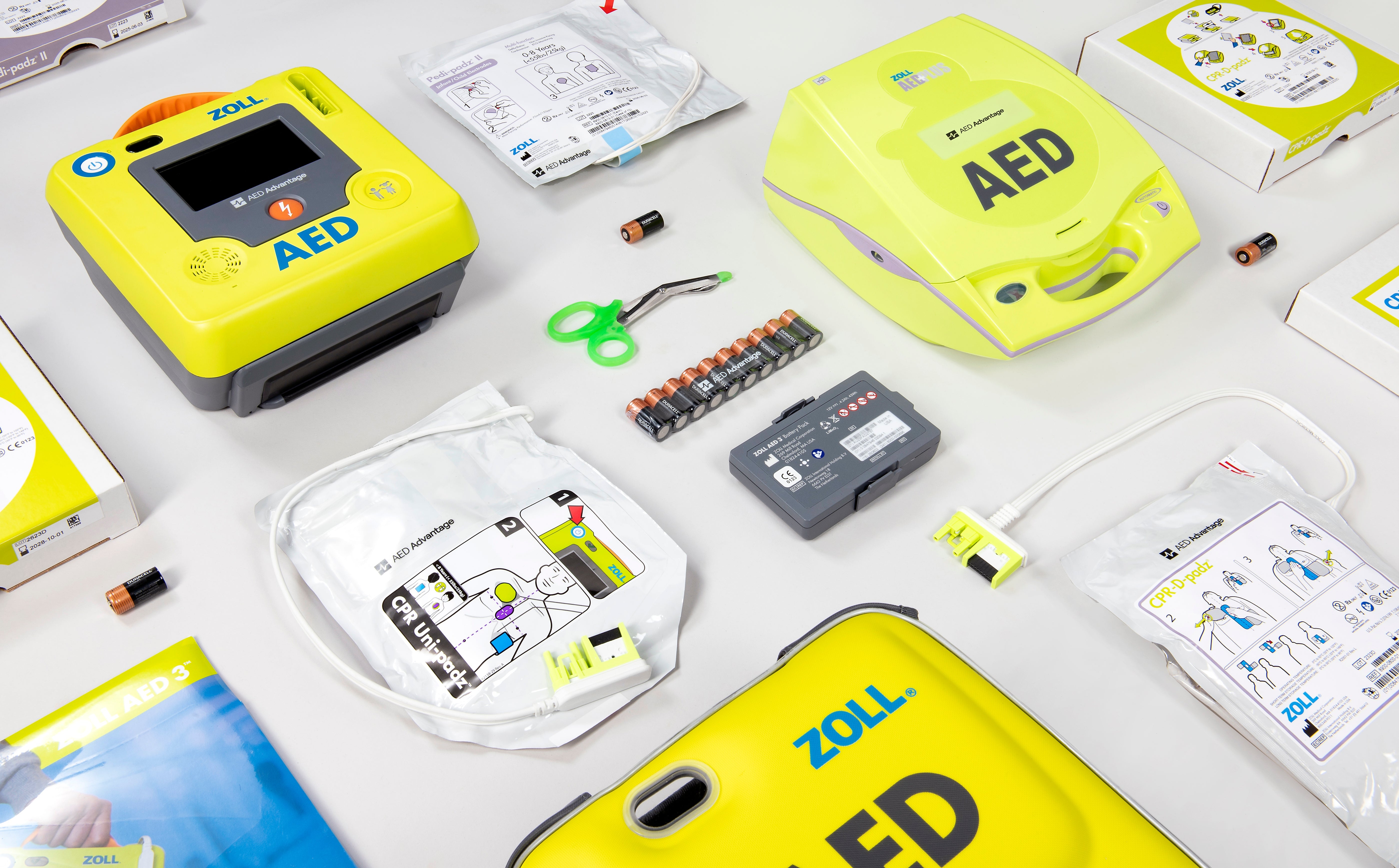 A collage of bright green ZOLL defibrillators and their accessories