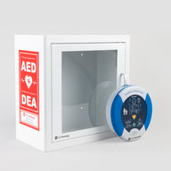 A blue and white HeartSine 350P AED standing in front of a white metal cabinet with red decals