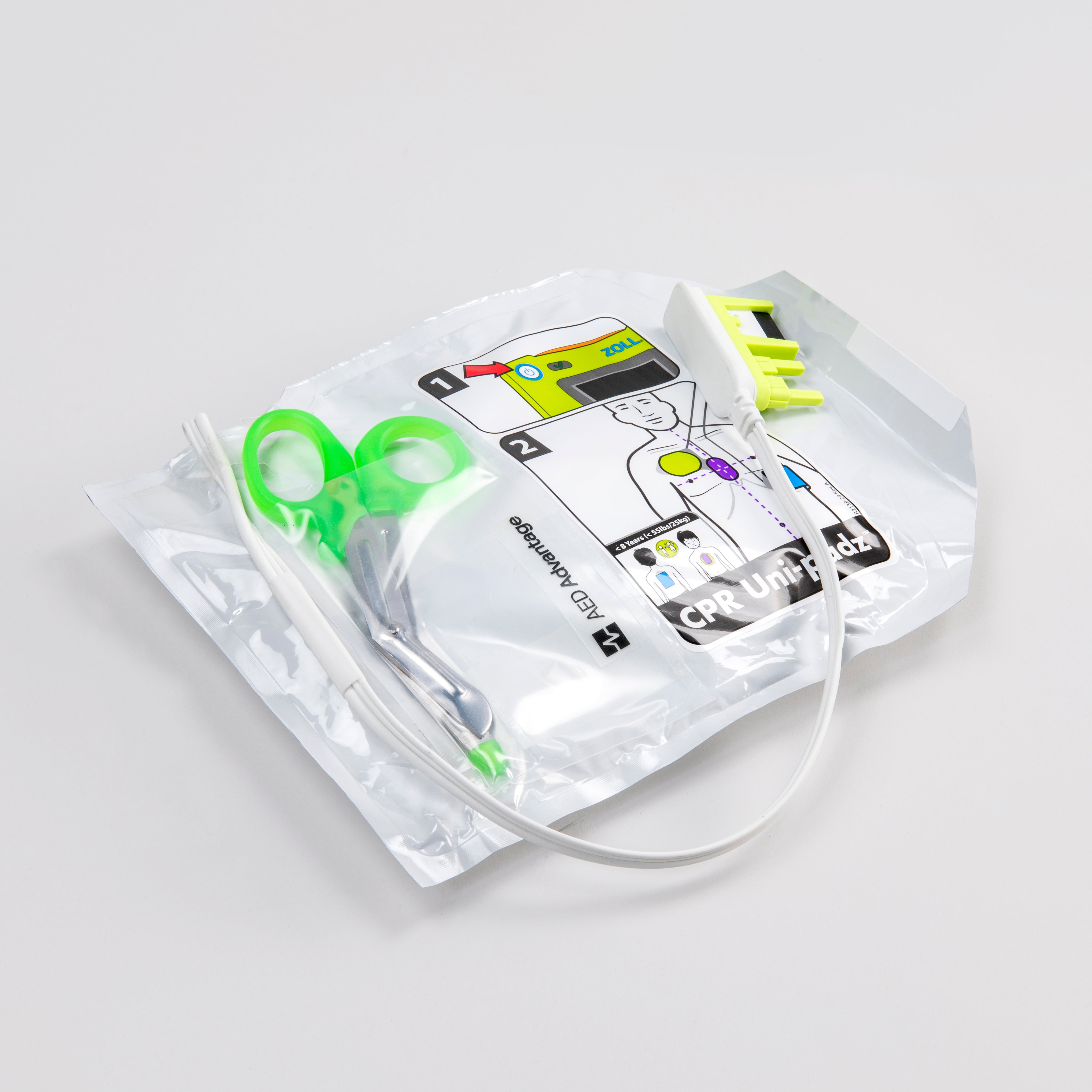 White foil package with scissors containing electrodes for the ZOLL AED 3 defibrillator