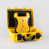 A yellow and black Defibtech Lifeline AED with a bright yellow hardshell carry case