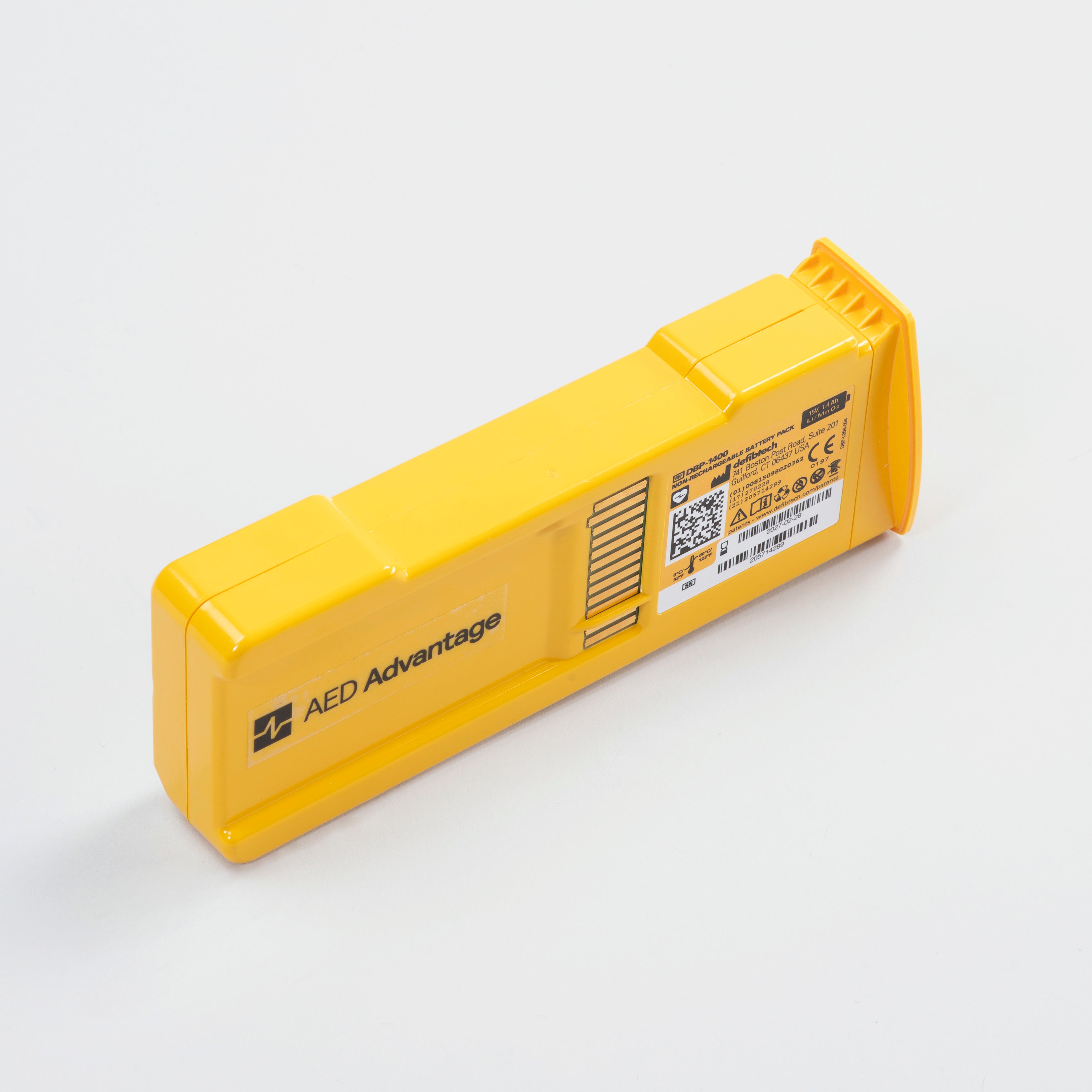 A rectangular yellow defibtech lifeline aed battery pack