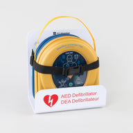 A HeartSine 350P AED in its yellow carry case strapped into a white wall mount bracket