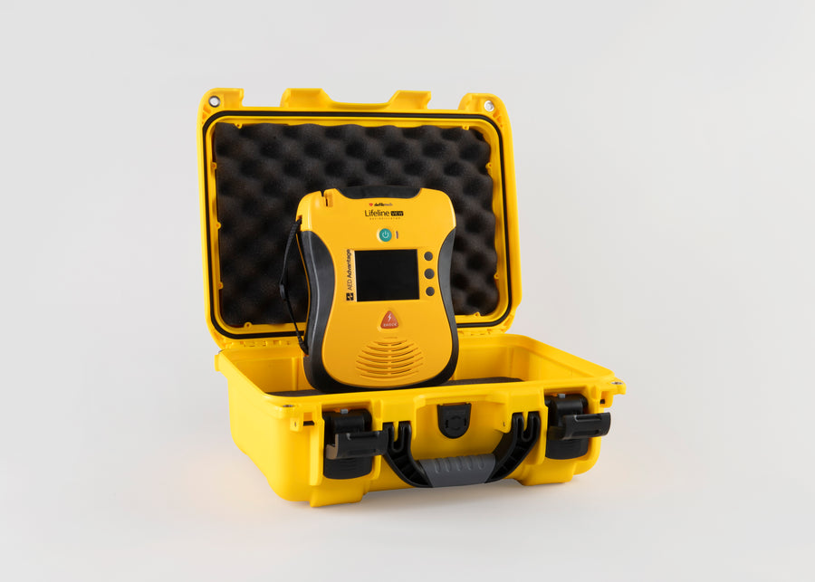 A yellow and black Defibtech Lifeline VIEW AED with a bright yellow hardshell carry case