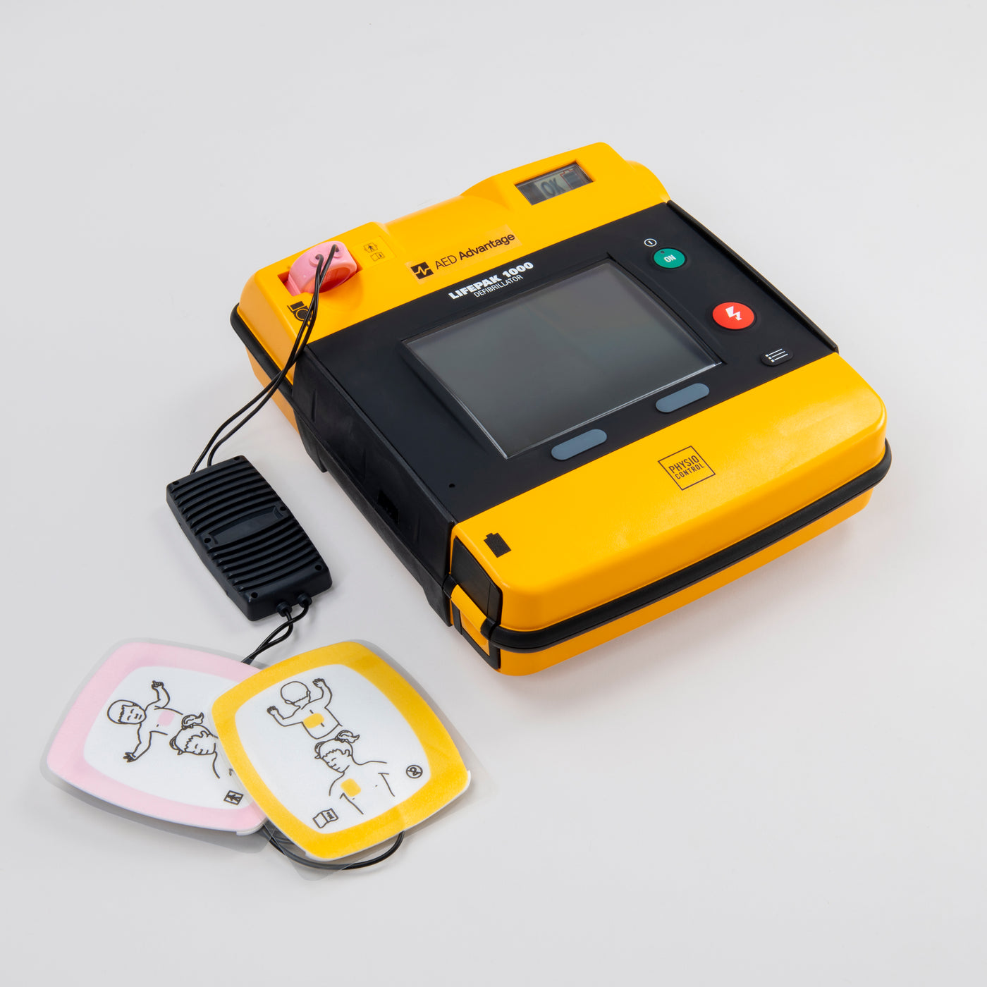 A black and yellow LIFEPAK 1000 AED with pediatric pads installed 