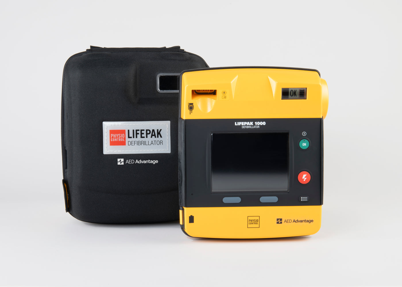 A black and yellow LIFEPAK 1000 AED standing next to its black carry case