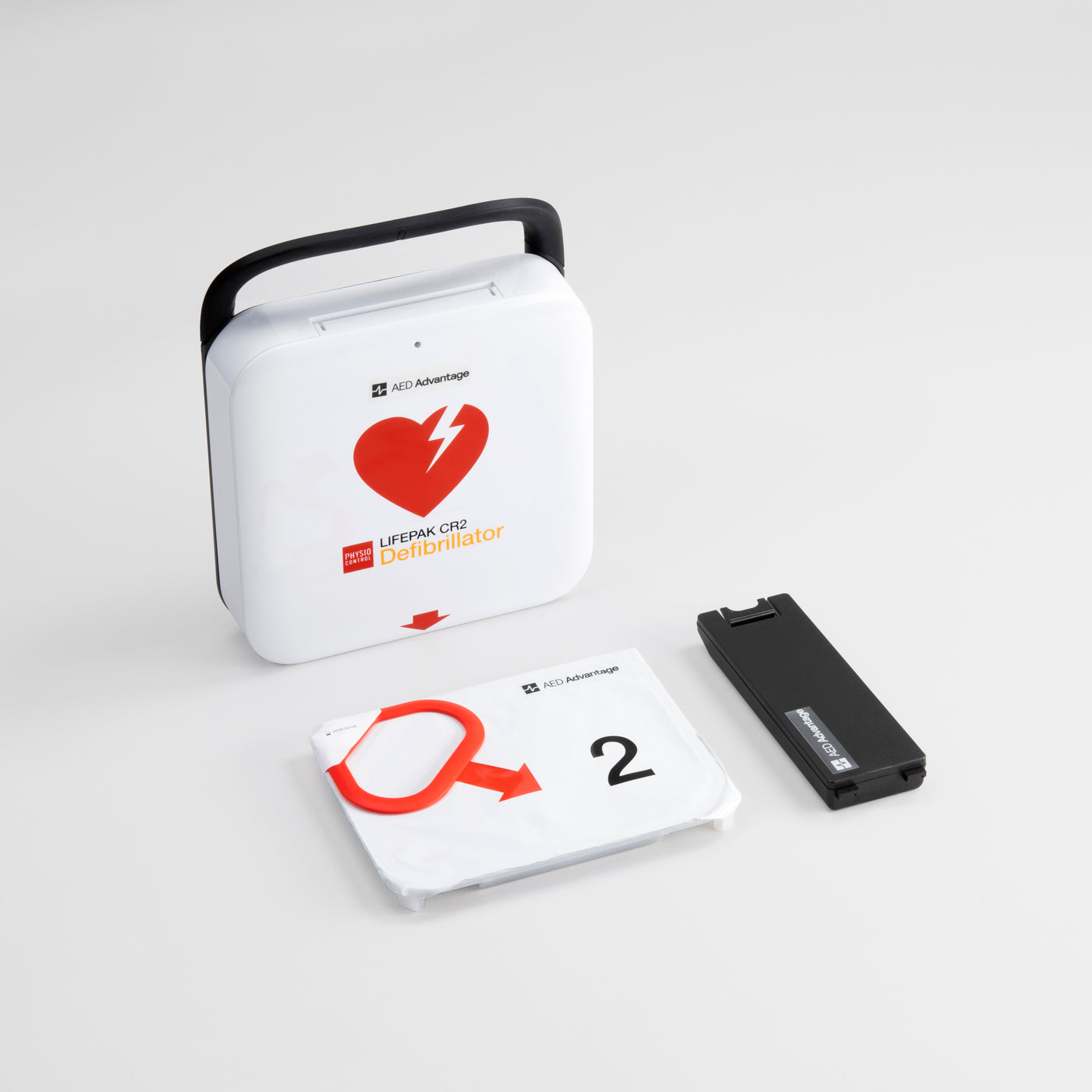 A white and red LIFEPAK CR2 AED with its electrode pad and battery