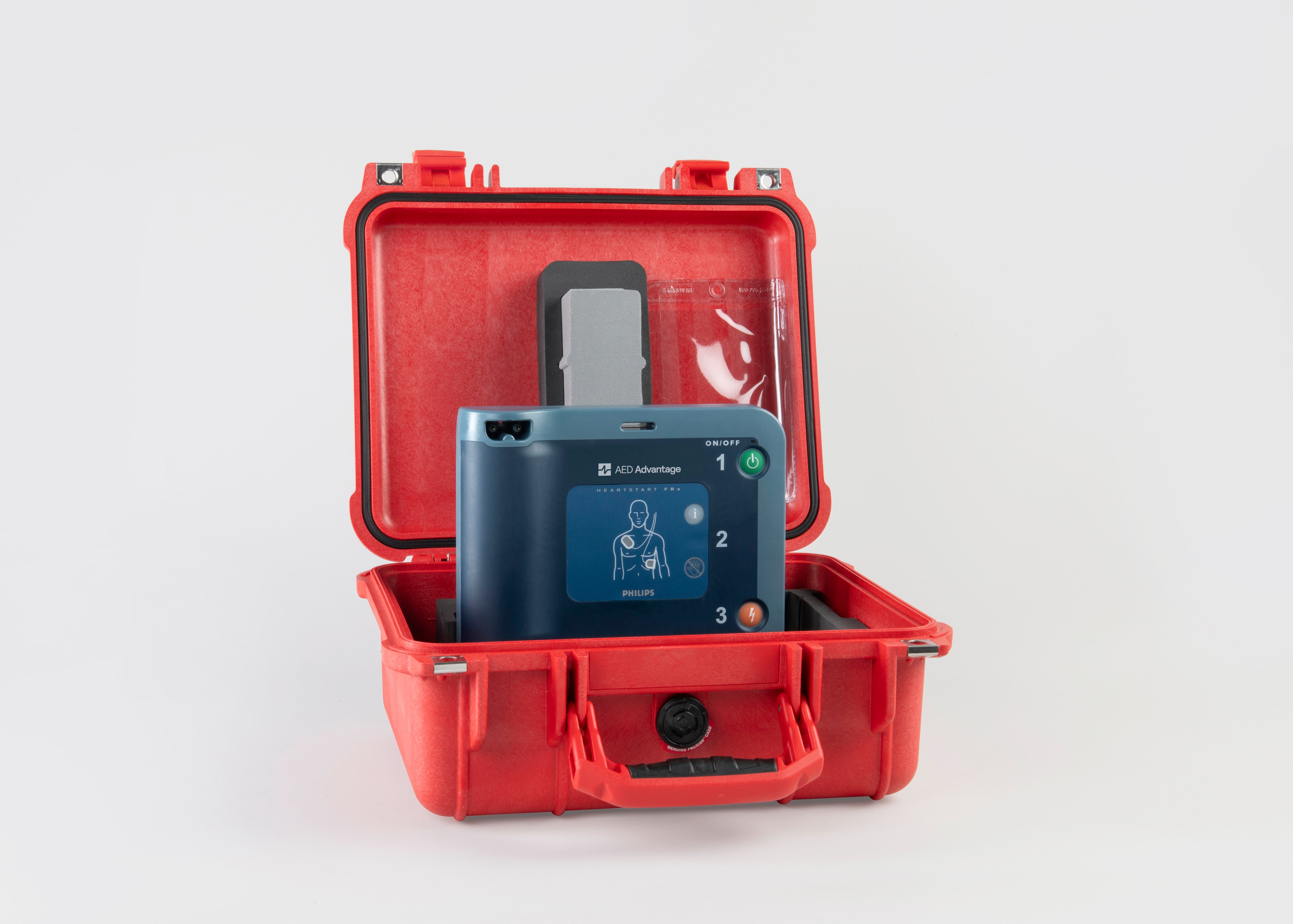 A blue Philips FRx AED machine inside a bright red hardshell carry case