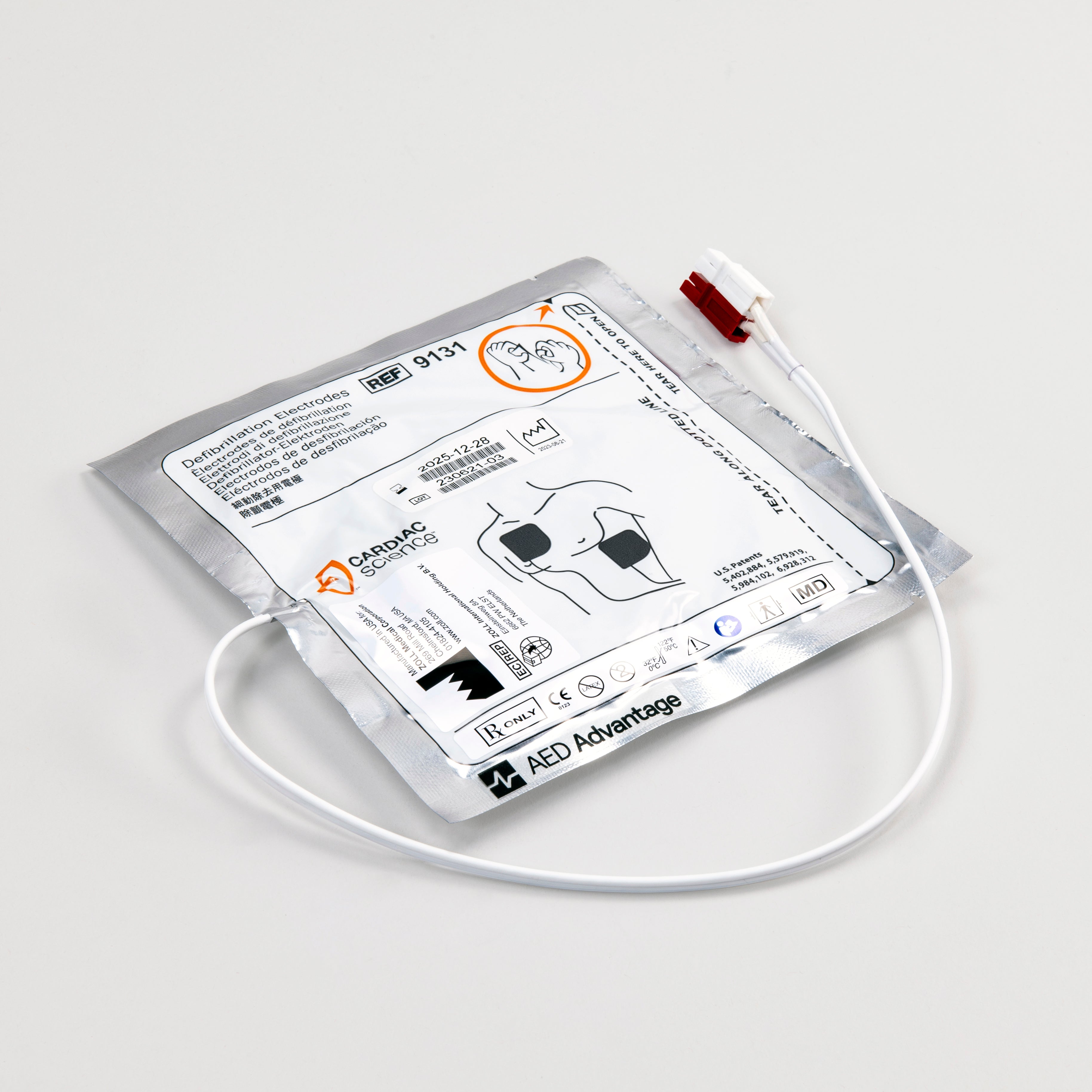 A white and silver square foil package with a white connector cord containing electrodes for the Powerheart G3 defibrillator