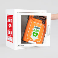 An orange Powerheart G5 AED being retrieved by hand from a white metal cabinet with red decals