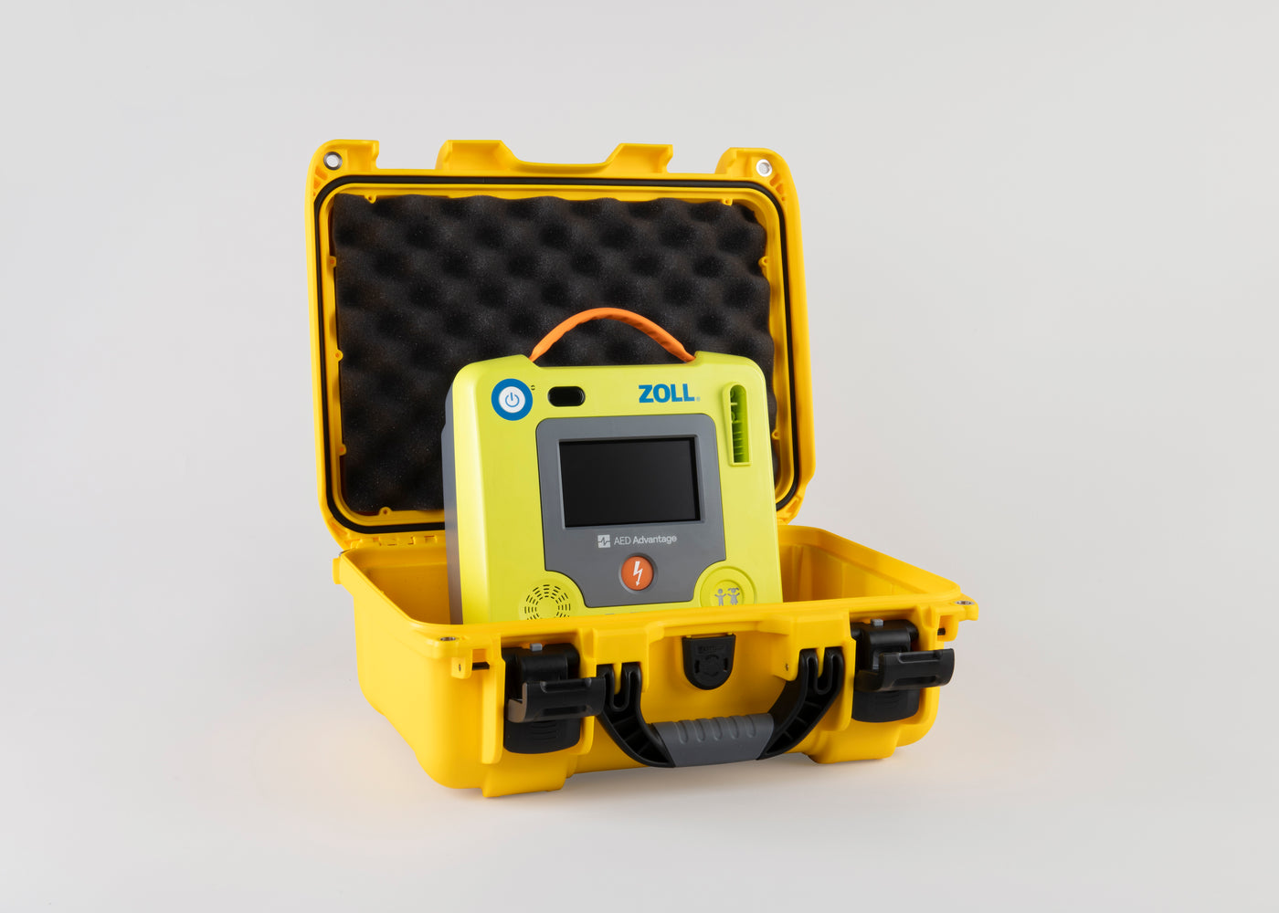 A green ZOLL AED 3 machine inside a bright yellow hardshell carry case
